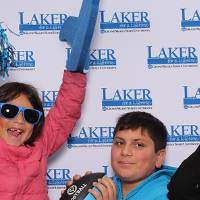 family of four posing together in group